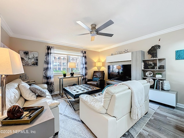 5375 Ortega Farms Blvd Unit 1011, Jacksonville, FL 32210 - living room featuring ornamental molding, wood finished floors, a ceiling fan, and baseboards