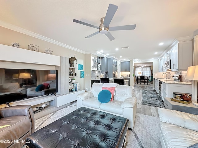 5375 Ortega Farms Blvd Unit 1011, Jacksonville, FL 32210 - living area with ornamental molding, a ceiling fan, light wood-style floors, and recessed lighting