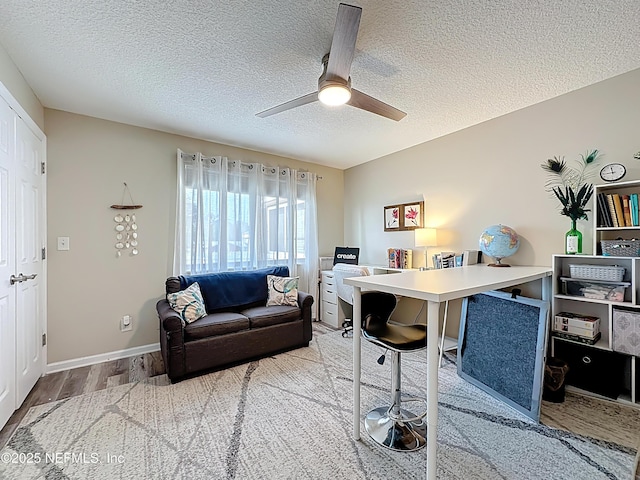 5375 Ortega Farms Blvd Unit 1011, Jacksonville, FL 32210 - office with wood finished floors, a textured ceiling, ceiling fan, and baseboards