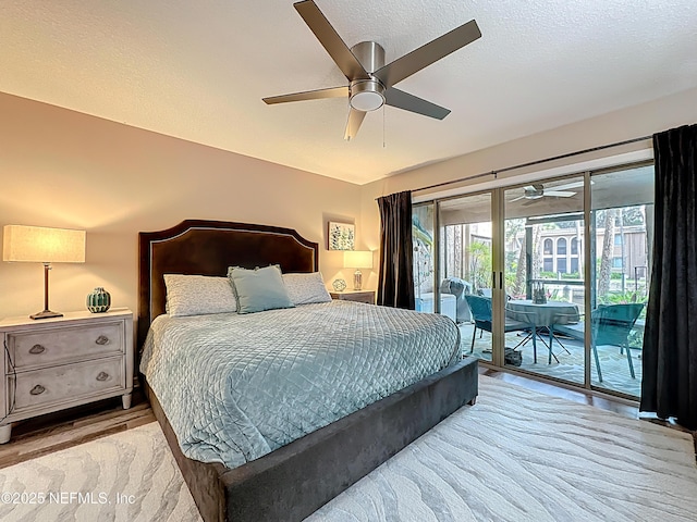 5375 Ortega Farms Blvd Unit 1011, Jacksonville, FL 32210 - bedroom with access to outside, light wood finished floors, ceiling fan, and a textured ceiling