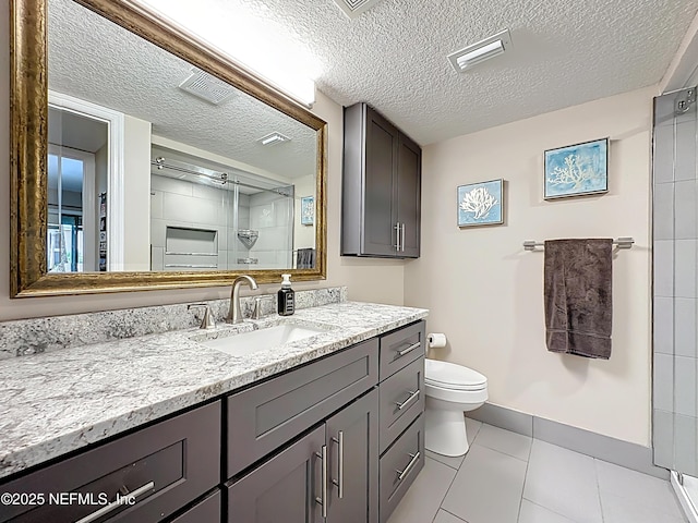 5375 Ortega Farms Blvd Unit 1011, Jacksonville, FL 32210 - bathroom with toilet, vanity, a textured ceiling, baseboards, and tile patterned flooring