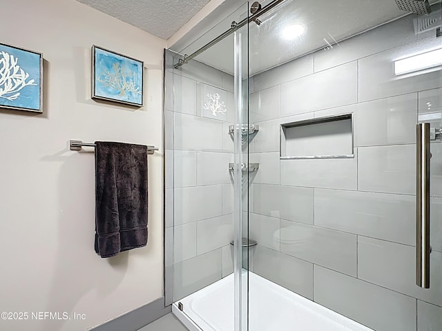 5375 Ortega Farms Blvd Unit 1011, Jacksonville, FL 32210 - bathroom with tiled shower and a textured ceiling