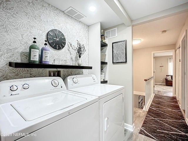 5375 Ortega Farms Blvd Unit 1011, Jacksonville, FL 32210 - washroom with washer and clothes dryer, wallpapered walls, and baseboards