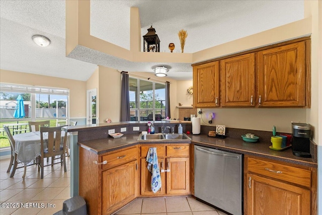 3910 Selig Ct, Middleburg, FL 32068 - kitchen featuring stainless steel dishwasher, a sink, a peninsula, light tile patterned floors, and brown cabinetry