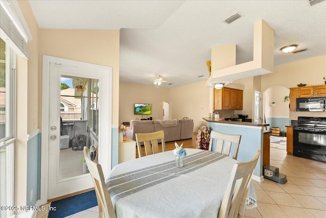 3910 Selig Ct, Middleburg, FL 32068 - dining area with arched walkways, a ceiling fan, and light tile patterned floors