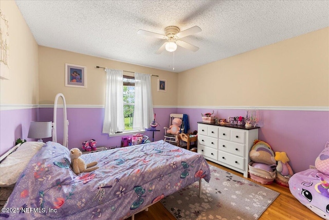 3910 Selig Ct, Middleburg, FL 32068 - bedroom with wood finished floors, a textured ceiling, and ceiling fan