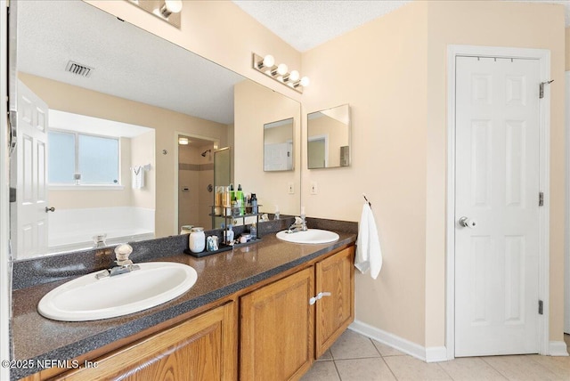 3910 Selig Ct, Middleburg, FL 32068 - full bath featuring a shower stall, a garden tub, double vanity, tile patterned floors, and baseboards