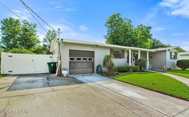 1133 Gunka Rd, Jacksonville, FL 32216 - ranch-style house with an attached garage, driveway, a gate, and a front yard