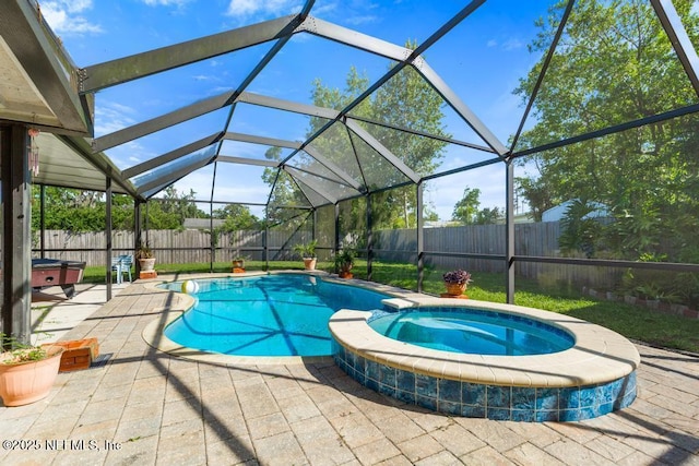 1133 Gunka Rd, Jacksonville, FL 32216 - view of swimming pool featuring a fenced backyard, a patio, a lanai, and a pool with connected hot tub
