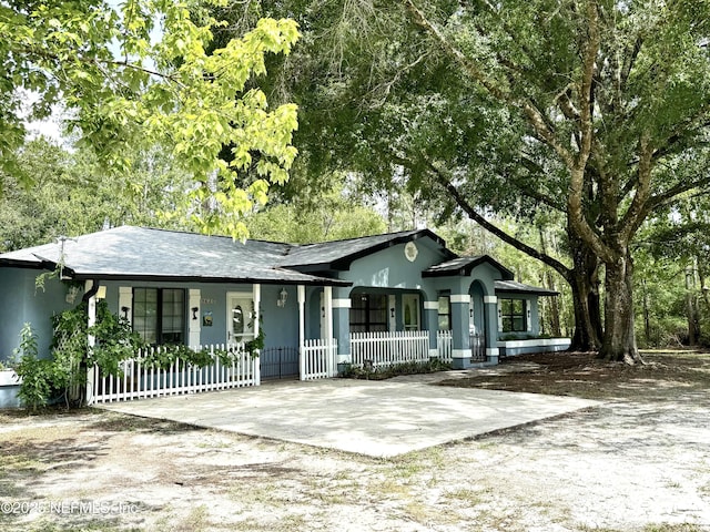 9620 Baylor Ave, Hastings, FL 32145 - ranch-style home with covered porch and stucco siding