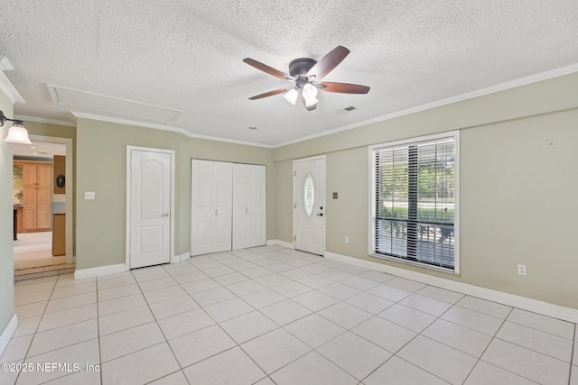 9620 Baylor Ave, Hastings, FL 32145 - foyer entrance with ceiling fan, crown molding, a textured ceiling, light tile patterned flooring, and baseboards