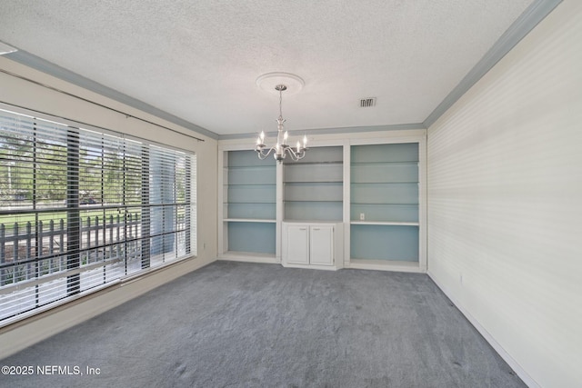 9620 Baylor Ave, Hastings, FL 32145 - unfurnished dining area featuring a textured ceiling, a chandelier, carpet floors, baseboards, and ornamental molding