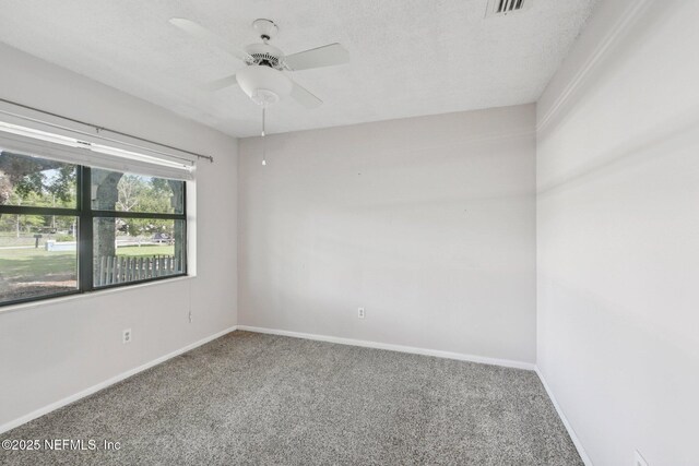 9620 Baylor Ave, Hastings, FL 32145 - spare room with carpet, baseboards, a ceiling fan, and a textured ceiling