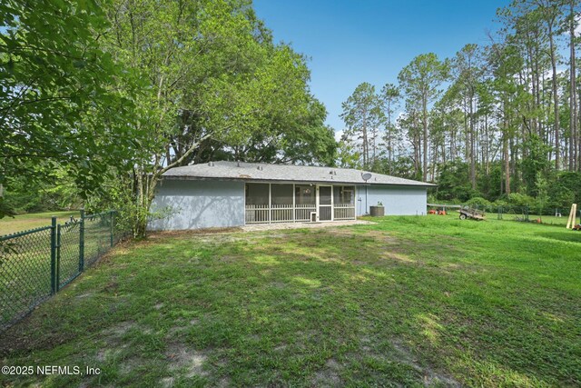 9620 Baylor Ave, Hastings, FL 32145 - rear view of property with a sunroom and stucco siding