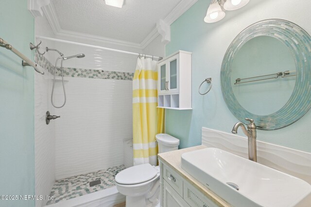 9620 Baylor Ave, Hastings, FL 32145 - bathroom featuring crown molding, tiled shower, toilet, vanity, and a textured ceiling