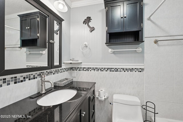 9620 Baylor Ave, Hastings, FL 32145 - bathroom with vanity, ornamental molding, toilet, and tile walls