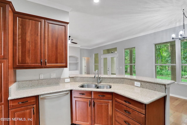 880 Buckeye Ln W, Saint Johns, FL 32259 - kitchen featuring dishwasher, plenty of natural light, a peninsula, light stone countertops, and crown molding