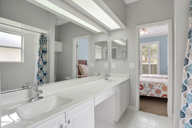 880 Buckeye Ln W, Saint Johns, FL 32259 - ensuite bathroom featuring double vanity, a ceiling fan, tile patterned flooring, and a shower with shower curtain