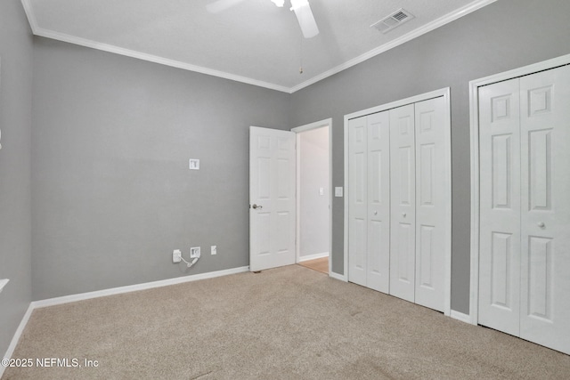 880 Buckeye Ln W, Saint Johns, FL 32259 - unfurnished bedroom with carpet floors, ornamental molding, multiple closets, baseboards, and ceiling fan