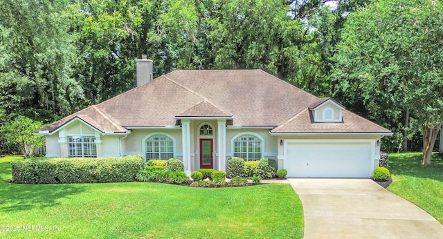 880 Buckeye Ln W, Saint Johns, FL 32259 - view of front facade with stucco siding, a front lawn, a chimney, driveway, and an attached garage