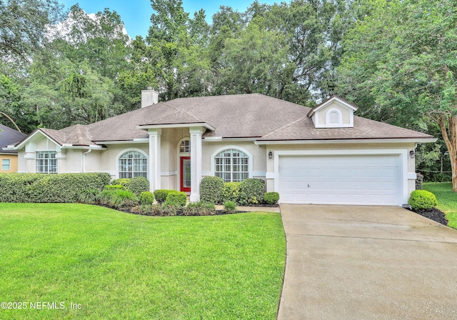 880 Buckeye Ln W, Saint Johns, FL 32259 - view of front of property with a front yard, concrete driveway, a shingled roof, and an attached garage