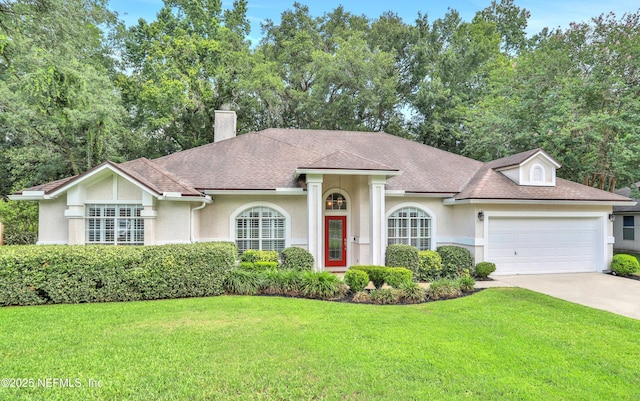 880 Buckeye Ln W, Saint Johns, FL 32259 - view of front of house with stucco siding, a front lawn, concrete driveway, an attached garage, and a chimney