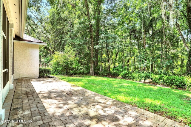 880 Buckeye Ln W, Saint Johns, FL 32259 - view of patio featuring a view of trees