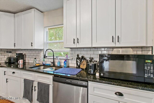 3020 Gilmore St, Jacksonville, FL 32205 - kitchen with dishwasher, black microwave, white cabinetry, dark stone countertops, and a textured ceiling