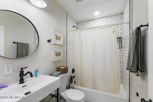 3020 Gilmore St, Jacksonville, FL 32205 - bathroom with shower / tub combo, a textured wall, and a textured ceiling