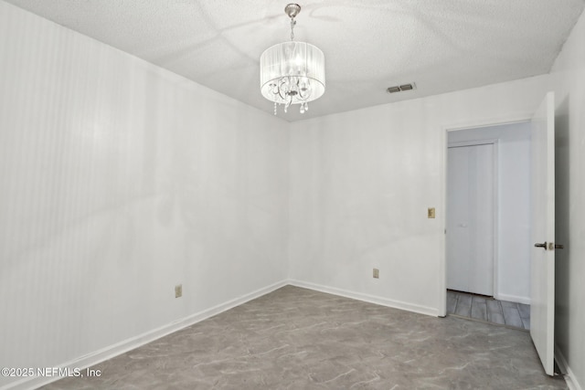 1247 Turtle Creek Dr N, Jacksonville, FL 32218 - empty room with a chandelier and a textured ceiling