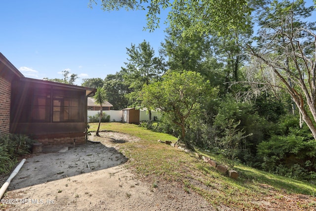 1247 Turtle Creek Dr N, Jacksonville, FL 32218 - view of yard featuring a sunroom and a patio area