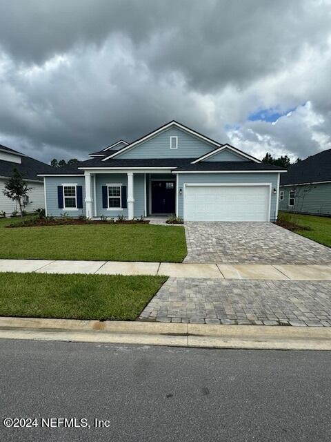 193 Silver Heron Way, Saint Augustine, FL 32092 - ranch-style house with decorative driveway, a garage, and a front yard