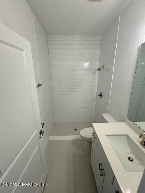 193 Silver Heron Way, Saint Augustine, FL 32092 - full bathroom featuring vanity, tiled shower, and toilet