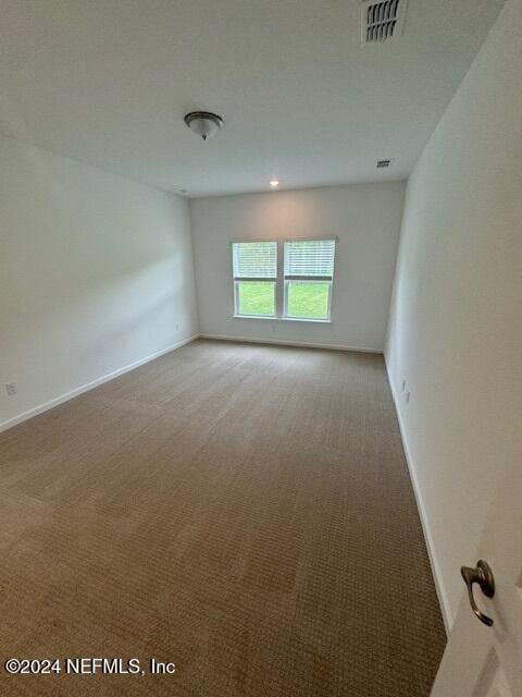 193 Silver Heron Way, Saint Augustine, FL 32092 - empty room featuring light carpet and baseboards