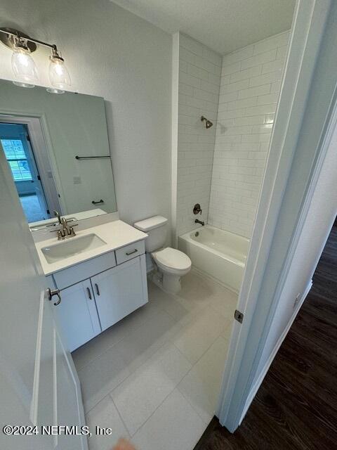 193 Silver Heron Way, Saint Augustine, FL 32092 - full bathroom with vanity, toilet,  shower combination, and tile patterned floors