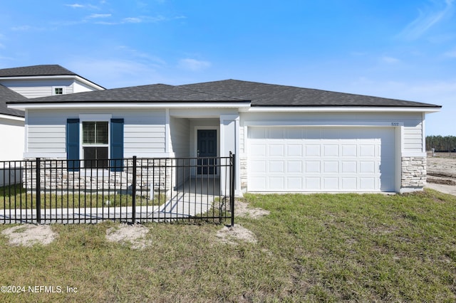 3369 Golden Eye Dr, Orange Park, FL 32065 - view of front of house with an attached garage, stone siding, and roof with shingles