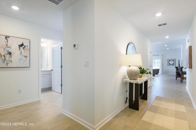 3369 Golden Eye Dr, Orange Park, FL 32065 - corridor with light wood finished floors, baseboards, and recessed lighting