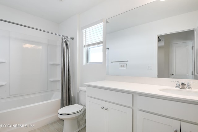 3369 Golden Eye Dr, Orange Park, FL 32065 - bathroom with toilet, vanity, and shower / bath combo with shower curtain