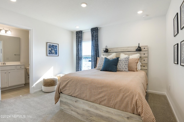 3369 Golden Eye Dr, Orange Park, FL 32065 - bedroom with light carpet, baseboards, ensuite bath, a sink, and recessed lighting