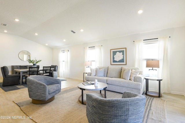 3369 Golden Eye Dr, Orange Park, FL 32065 - living area featuring light wood-style floors, recessed lighting, baseboards, and lofted ceiling