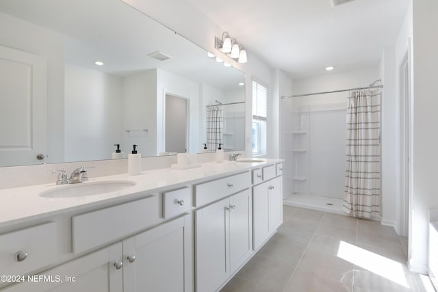 3369 Golden Eye Dr, Orange Park, FL 32065 - bathroom featuring a shower with shower curtain, double vanity, tile patterned floors, and recessed lighting