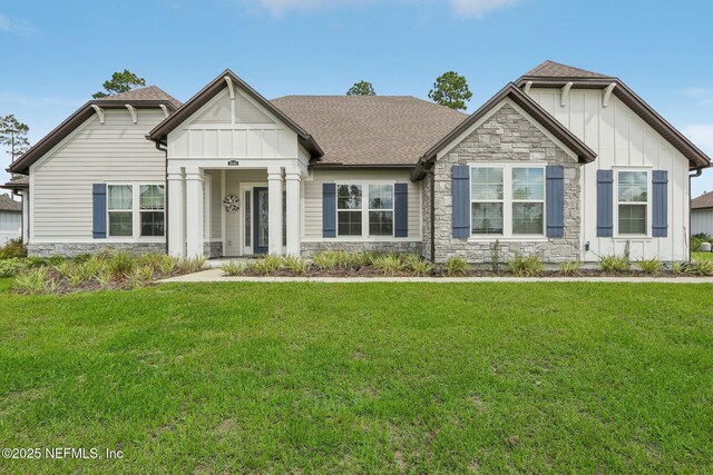 36461 Shortleaf Ave, Hilliard, FL 32046 - craftsman-style house featuring stone siding, board and batten siding, and a front yard