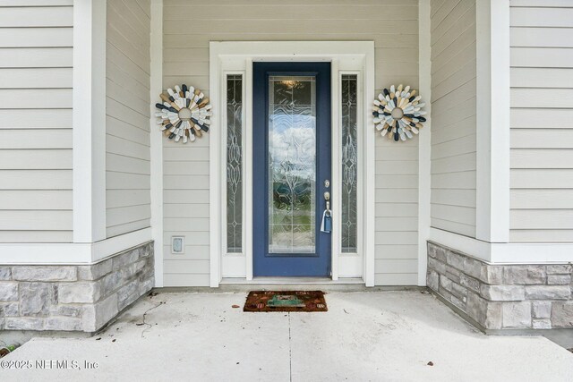 36461 Shortleaf Ave, Hilliard, FL 32046 - doorway to property with stone siding and covered porch