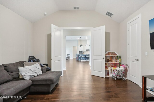 36461 Shortleaf Ave, Hilliard, FL 32046 - living area featuring dark wood-style floors and lofted ceiling