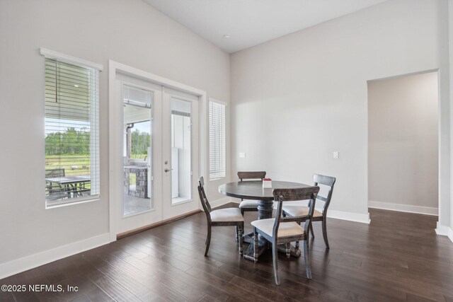 36461 Shortleaf Ave, Hilliard, FL 32046 - dining area with french doors, dark wood-style floors, and baseboards