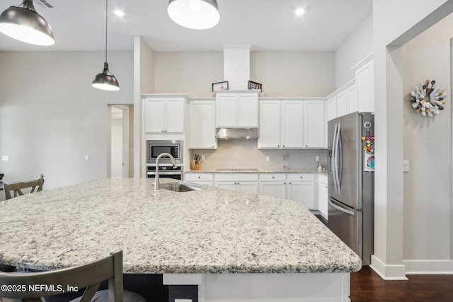 36461 Shortleaf Ave, Hilliard, FL 32046 - kitchen with appliances with stainless steel finishes, under cabinet range hood, dark wood-type flooring, and white cabinets
