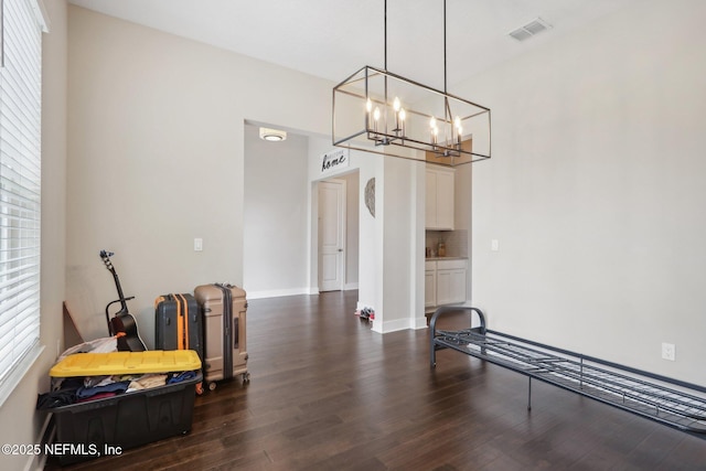 36461 Shortleaf Ave, Hilliard, FL 32046 - dining space featuring dark wood-style flooring, a chandelier, and baseboards