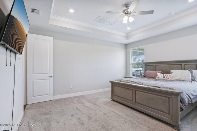 36461 Shortleaf Ave, Hilliard, FL 32046 - bedroom with a tray ceiling, crown molding, light carpet, recessed lighting, and baseboards