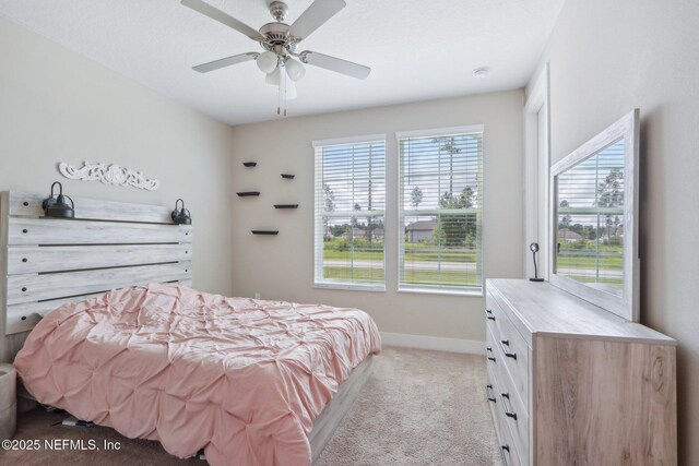36461 Shortleaf Ave, Hilliard, FL 32046 - bedroom with light carpet, baseboards, and a ceiling fan
