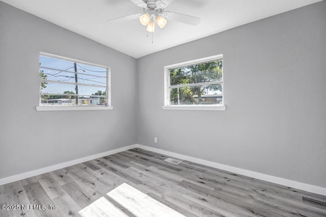 6903 Mayapple Rd, Jacksonville, FL 32211 - spare room featuring wood finished floors and ceiling fan